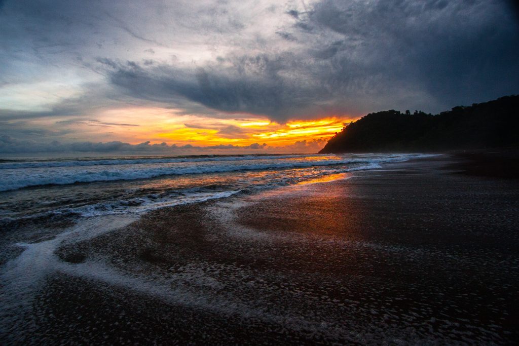 Sunset on the waves at Jaco, Costa Rica