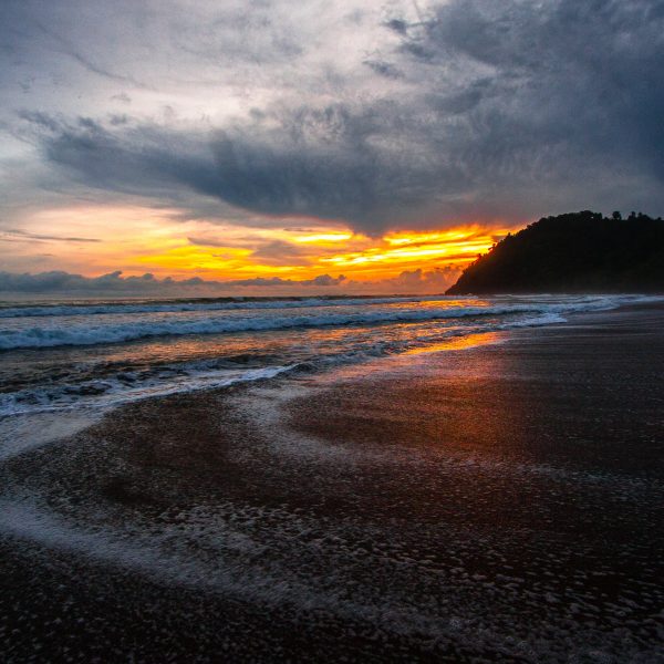 Sunset on the waves at Jaco, Costa Rica