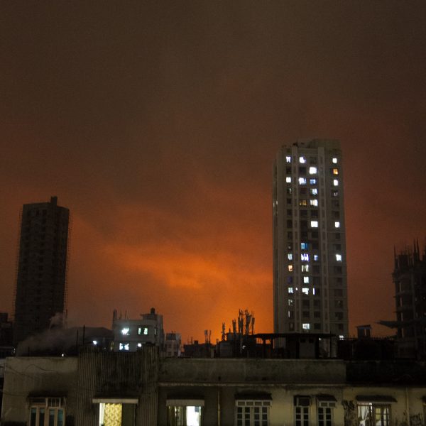 Oil fire burns in the distance in Mumbai