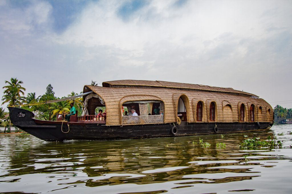 A houseboat cruising the Kerala backwaters, Allepey, India